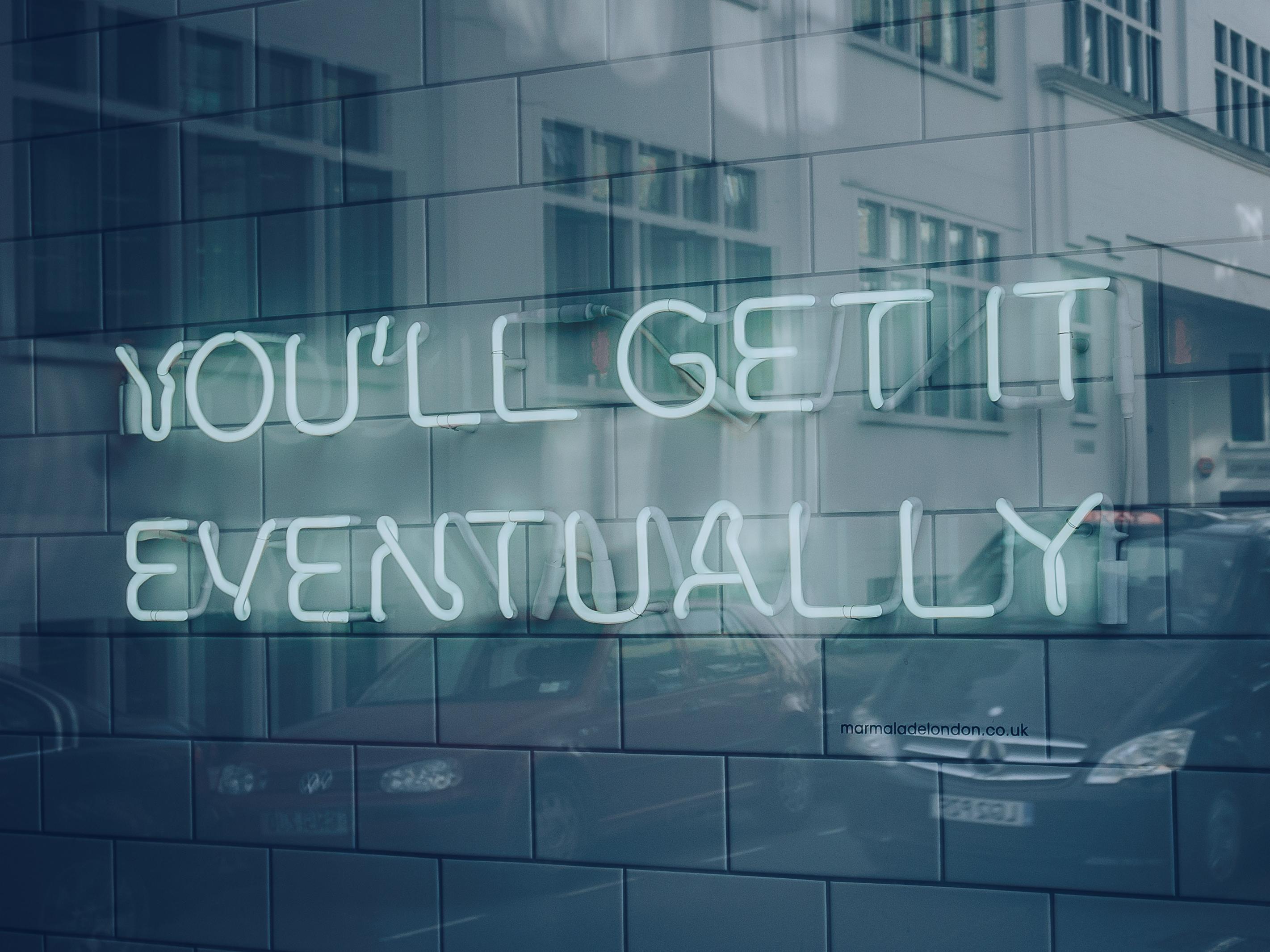 neon sign "you'll get it eventually"