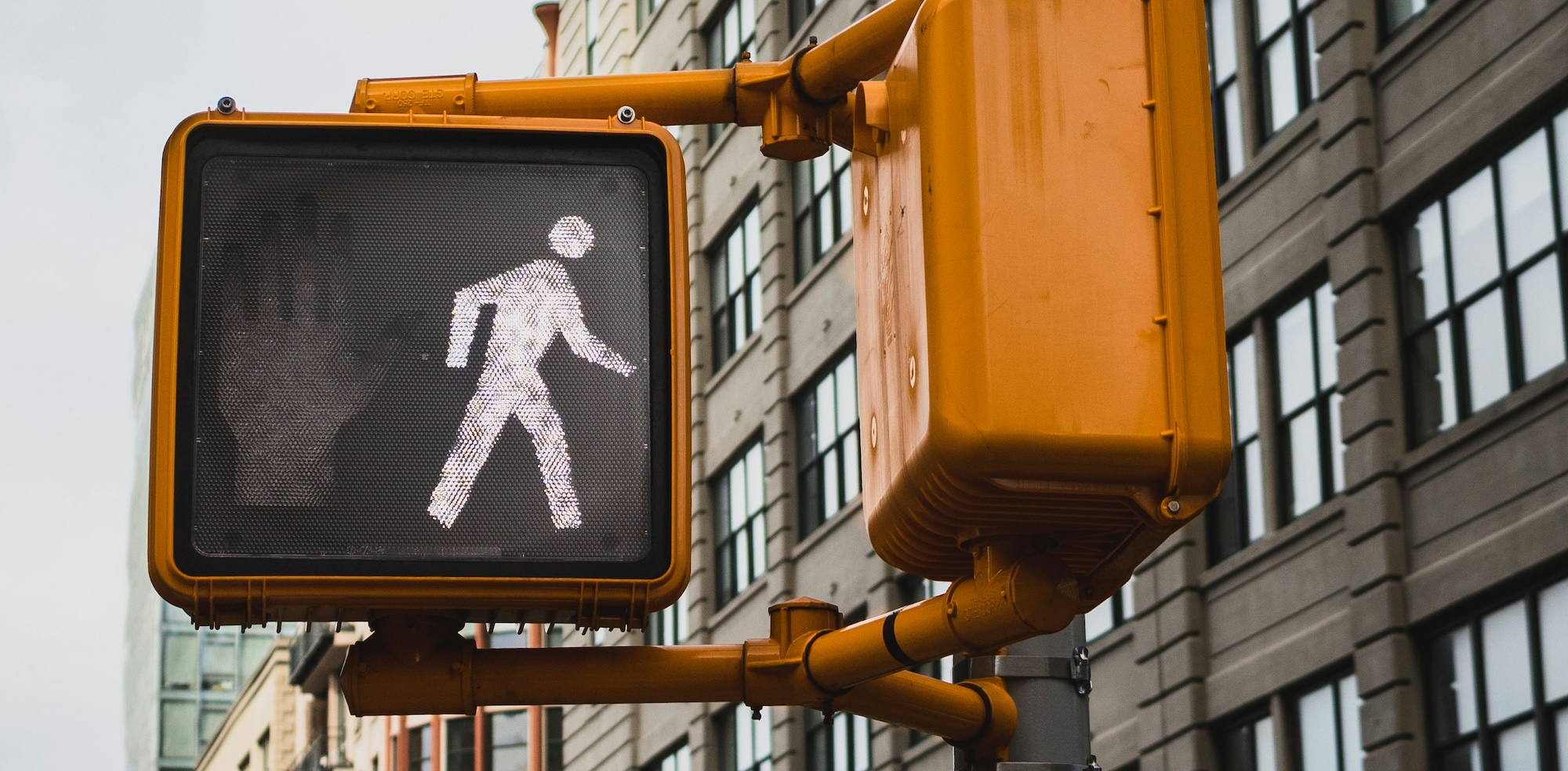 Close up of a pedestrian walk signal that is lit.